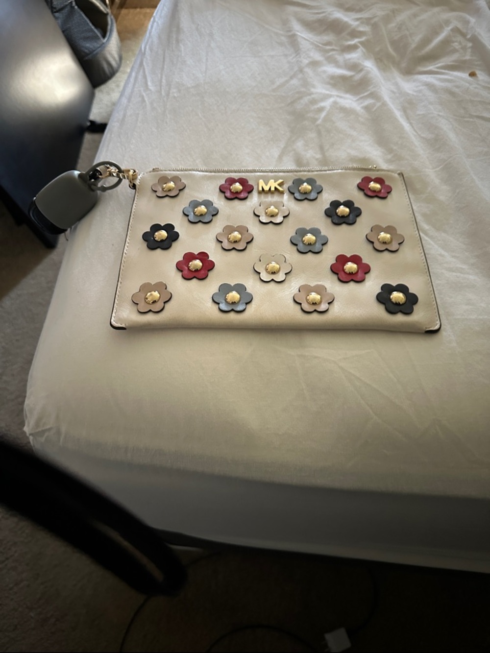 Michael Kors Cream Wristlet with Multicolor Floral Accents